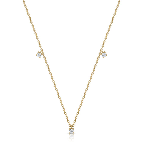 Gold necklace with claws, tambourine, and topaz